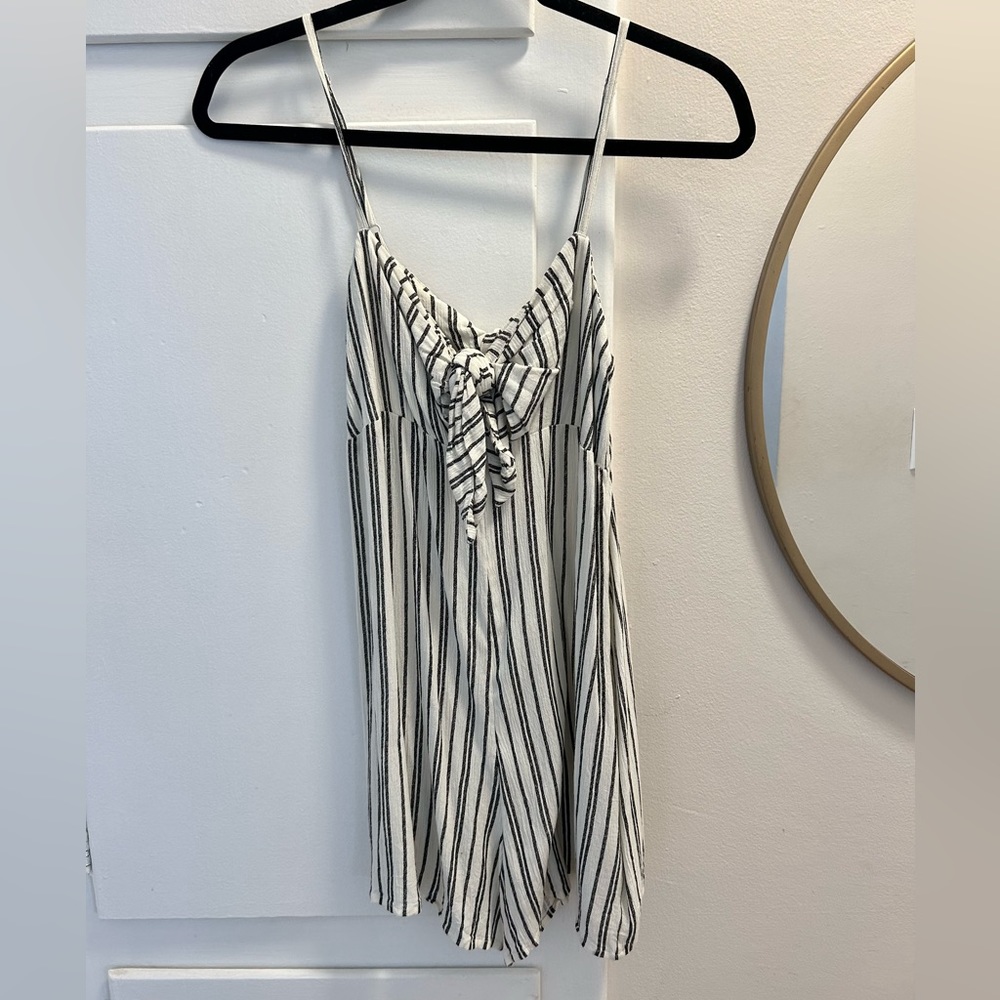Billabong romper. Cream with black stripes flowy with a tie front detail size S